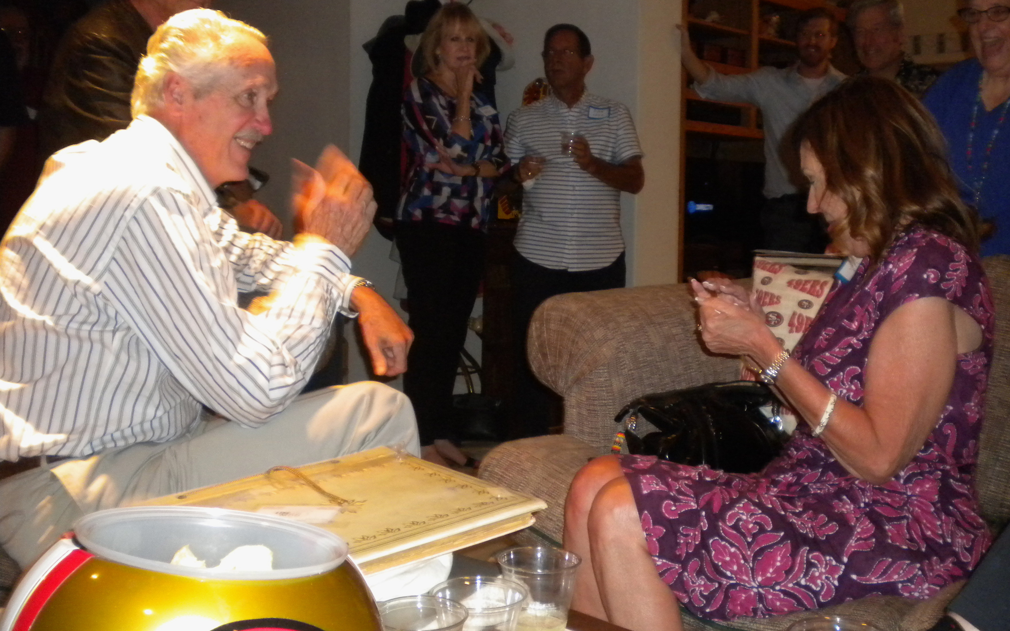 Guy Denechaud, ?, ?, Janet Lipari; what is he showing her?